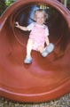 Anna having fun on a slide in Greenbelt, August 2003. Photo by Chris Harvey