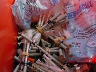 used needles from Baltimore's needle-exchange program / Photo by Fanen Chiahemen