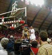 Guard Juan Dixon helps cut down the net following the Terps' last game at Cole Field House March 3. / Photo by Maha Ezzeddine