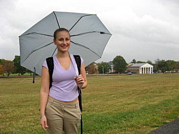 Rudd walks to class in the rain