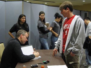 Frank Warren signs his book after his lecture at the University of Maryland, College Park.
