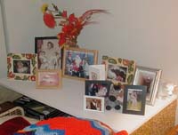 Vera's display of family photographs at her home.